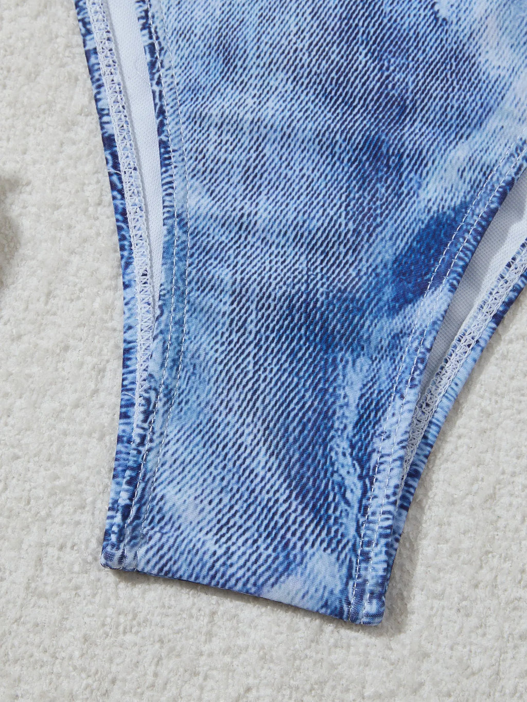 Denim blue women's bikini set with printed design and strap detail, sizes S to XL.