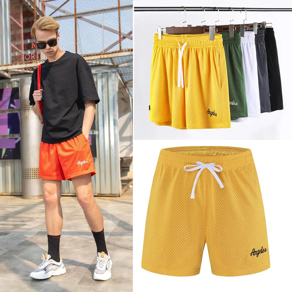 Men's black double-layer mesh sport shorts on a white background
