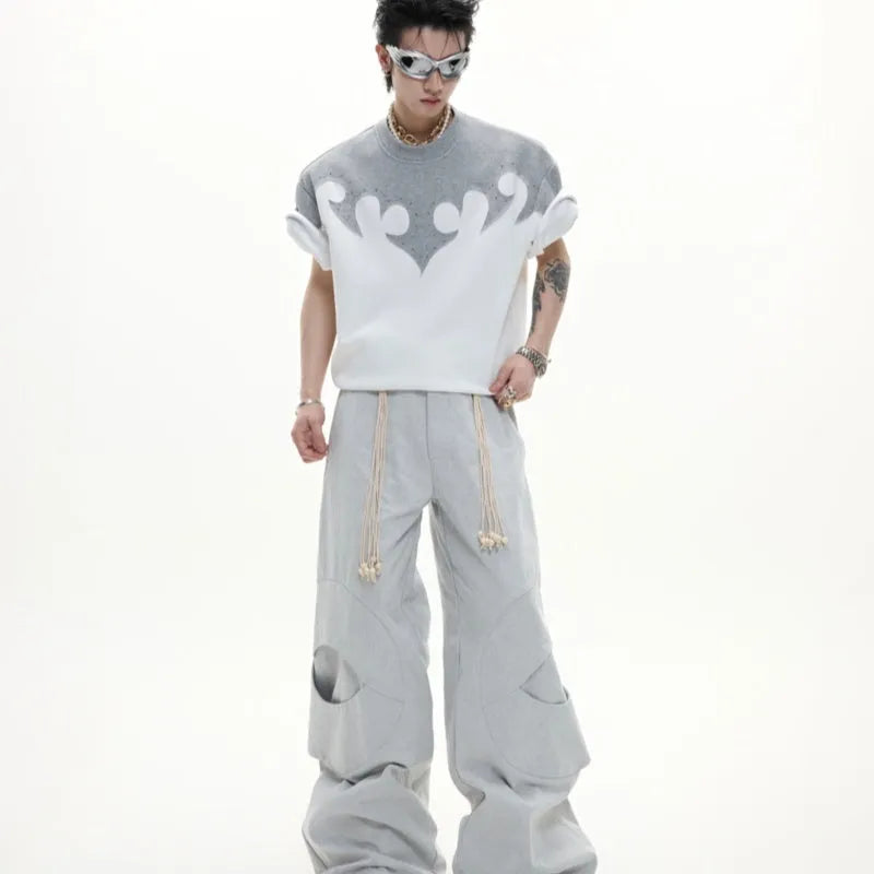 Men's grey cotton T-shirt with a textured burnt flower design and rhinestone details on the front.