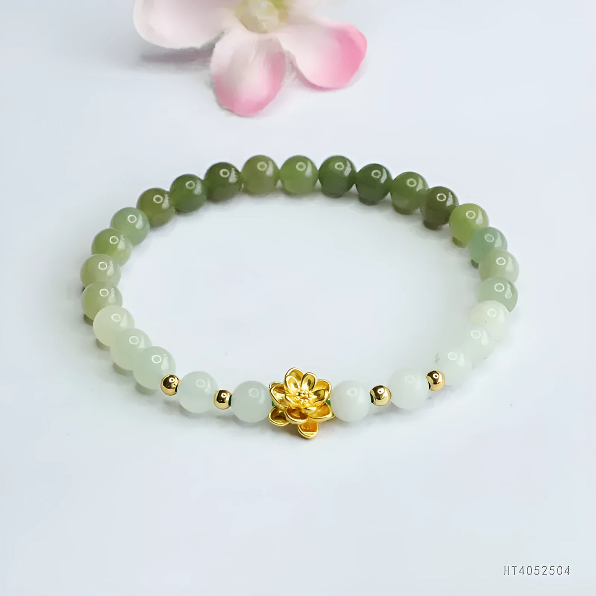 Hand-woven Hetian jade bracelet with sunshine water gradient colour and floral design.