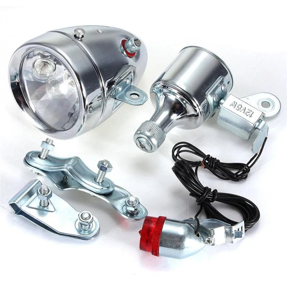 Silver bicycle dynamo light set with generator unit and wiring for front fork or rear frame mounting