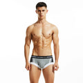 Men's cotton boxer shorts in red, dark blue, or light grey, showing low waist design