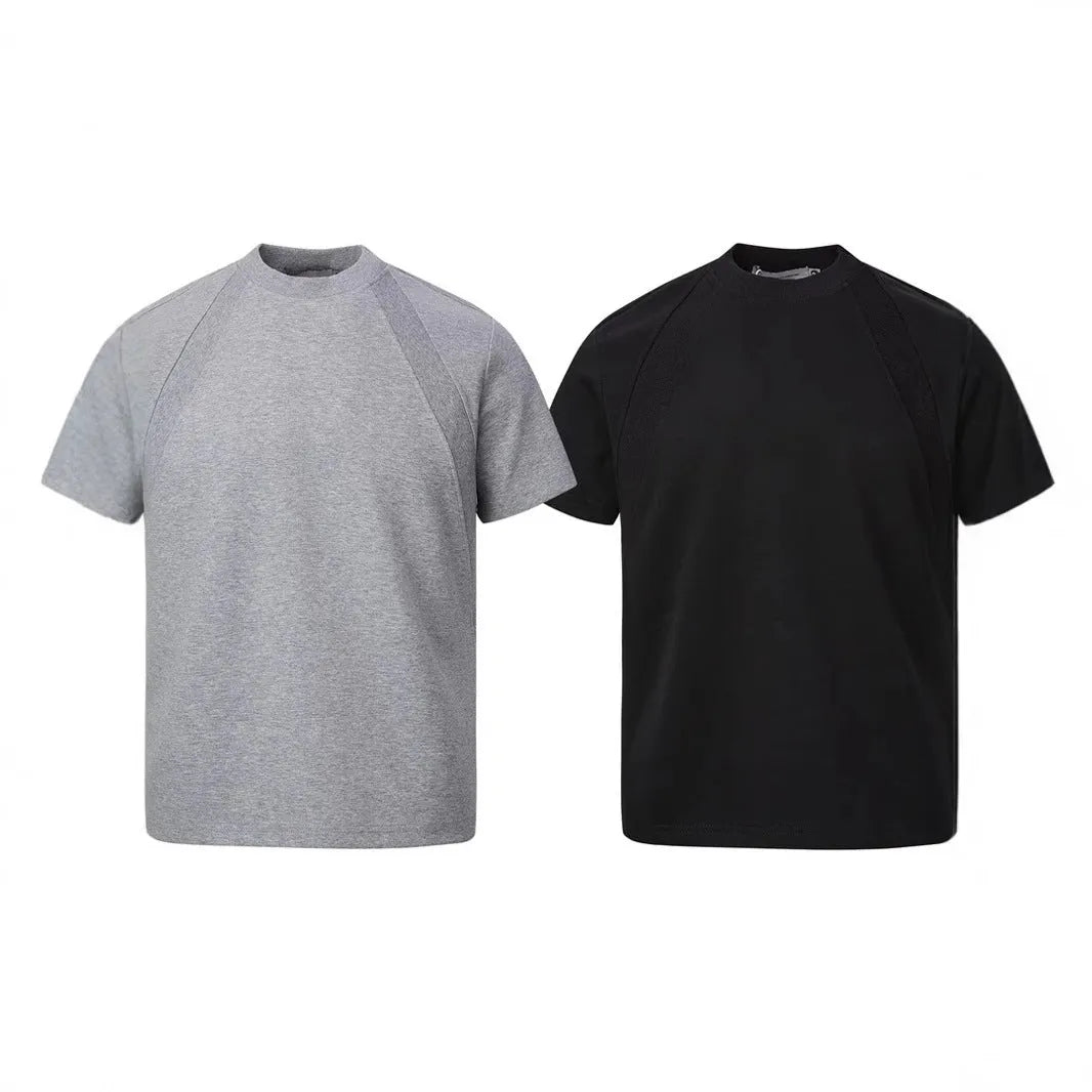 Black loose fit short sleeve top with textured air layer stitching design.