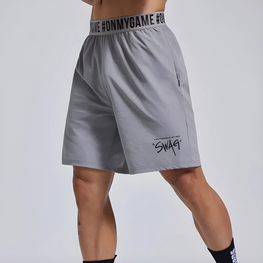 Men's loose black athletic shorts with elastic waist for sports and workouts