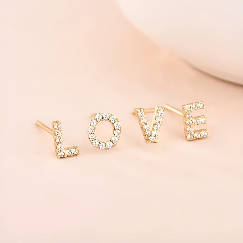 Gold plated alphabet letter earrings showing English characters A to Z with zircon decorative accents
