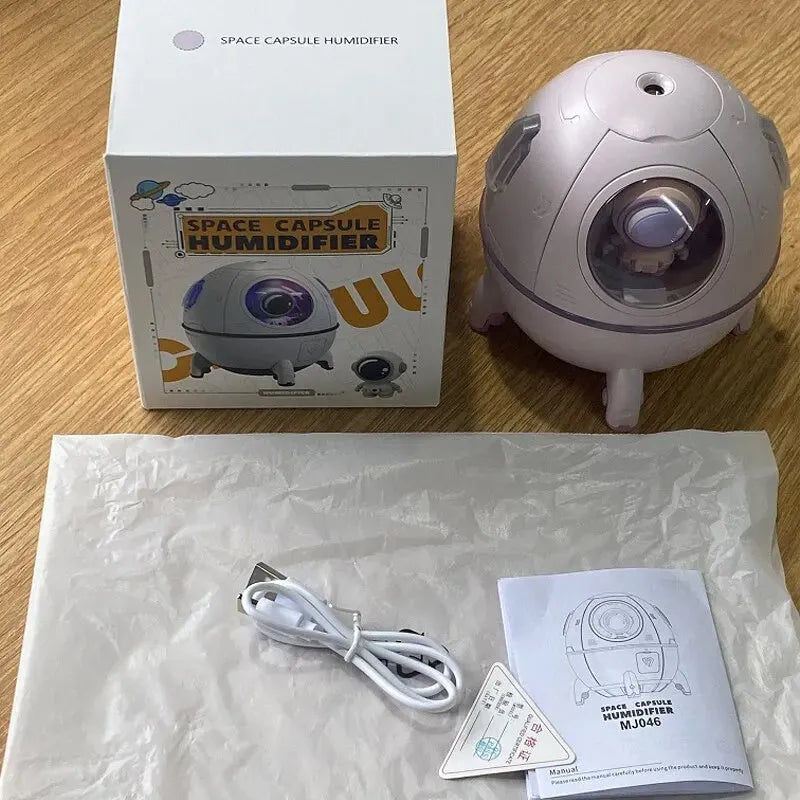 Astronaut-shaped desktop USB humidifier with colourful LED light and 220ml water tank.