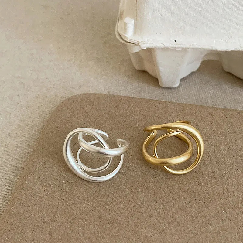 Three-dimensional interlaced geometric open ring with matte metal finish