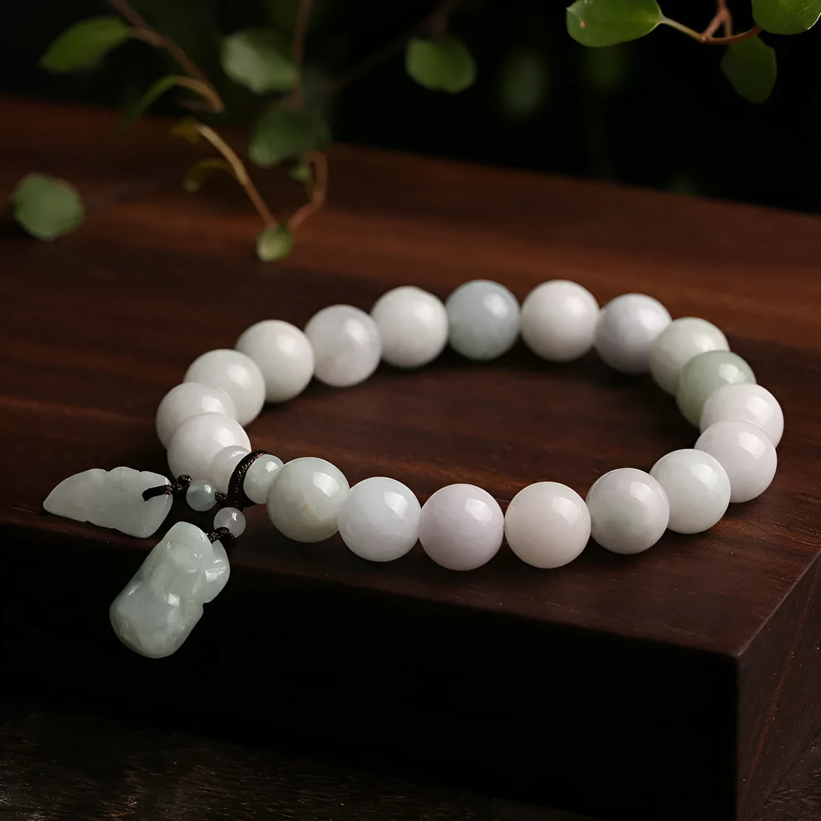 Natural jade bracelet with geometric pendant and hanging charms including Maitreya Buddha, gourd, and double apple designs