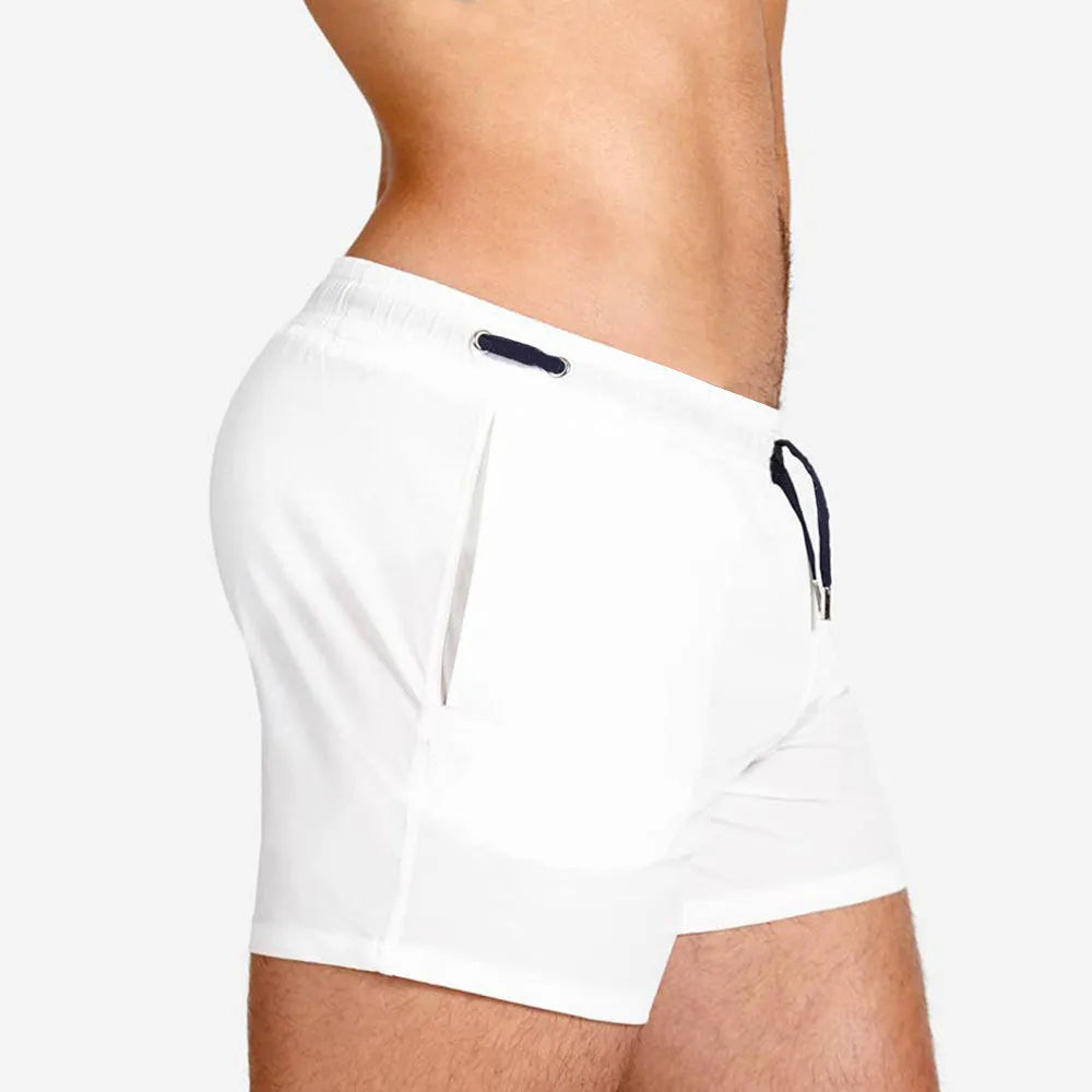 Solid colour swimming shorts with mesh lining for sports and fitness activities