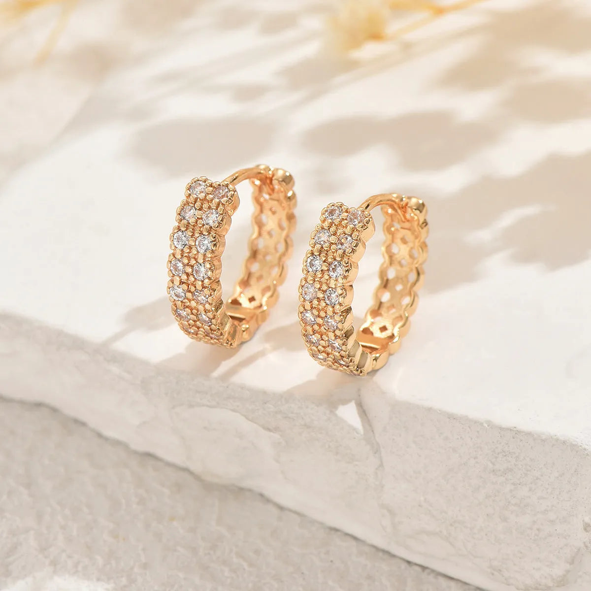Geometric pattern copper ear studs with dot and ring design elements