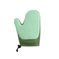 Right hand pet hair remover glove in dark blue, light green, or yellow on a fabric sofa.
