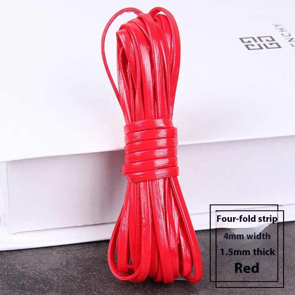 Coiled PU leather woven craft string in multiple colours including beige, black, red, blue, green, gold, and silver.