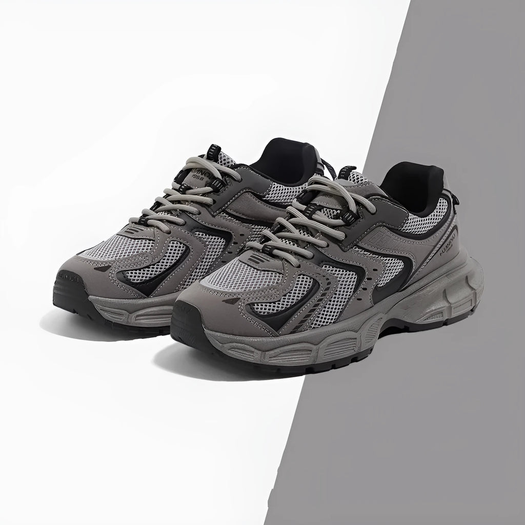 Grey low-top platform casual sneakers with leather stitching detail on a PU mesh upper.