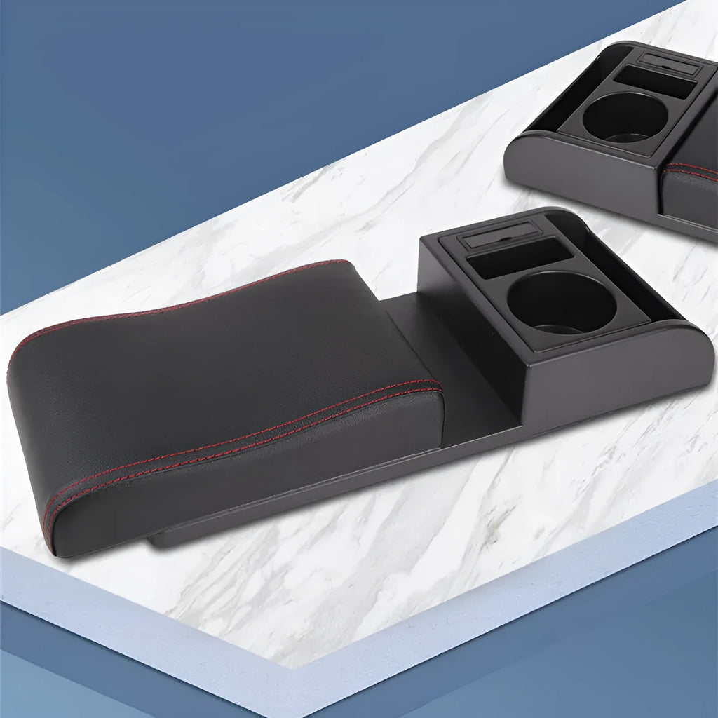 Universal plastic car armrest cover in black with red cord stitching on a centre console