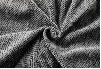 Man's straight-leg fleece-lined trousers in black with an elastic waistband, showing hollow-out fabric texture.