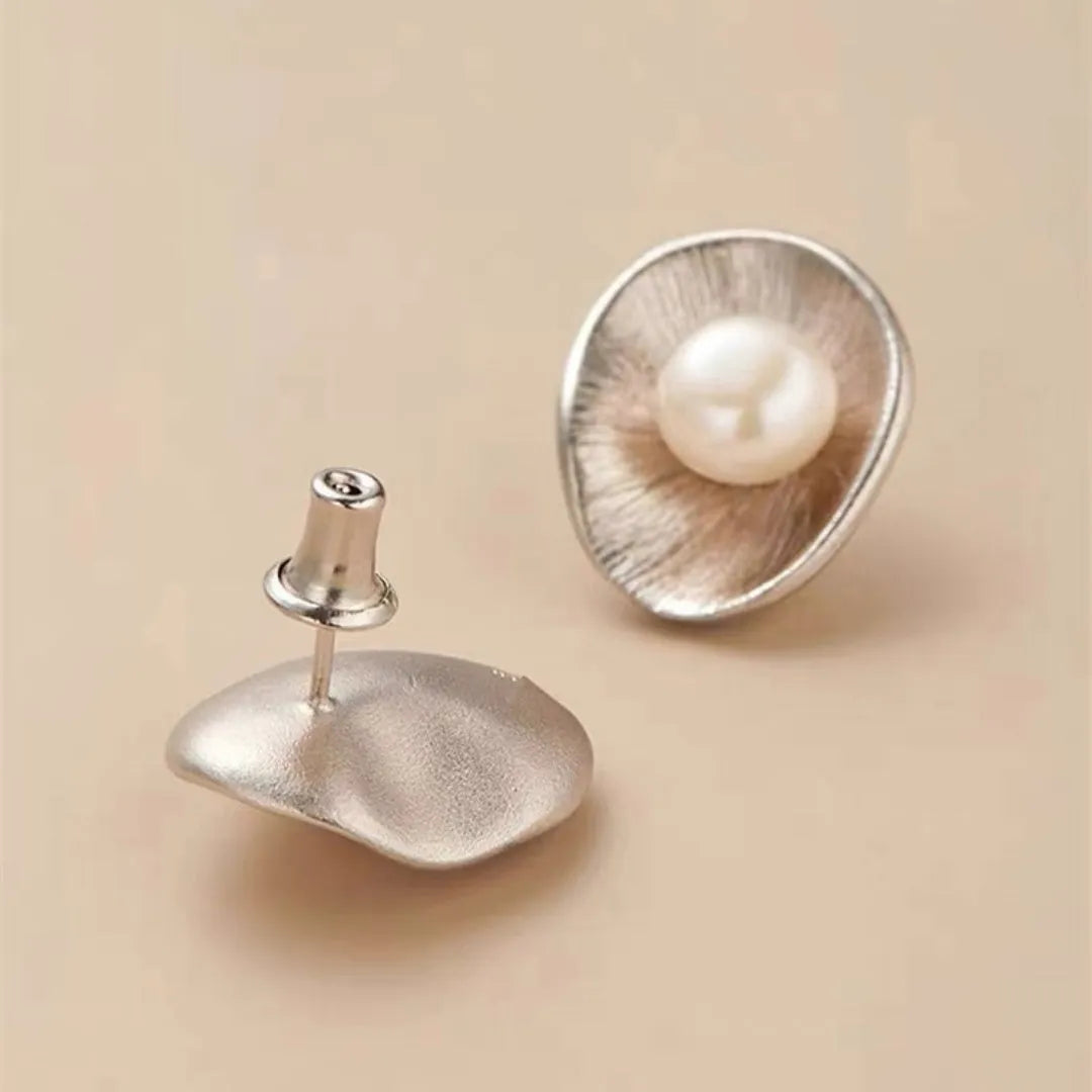 Gold-coloured geometric pearl stud earrings made from sterling silver with electroplated finish