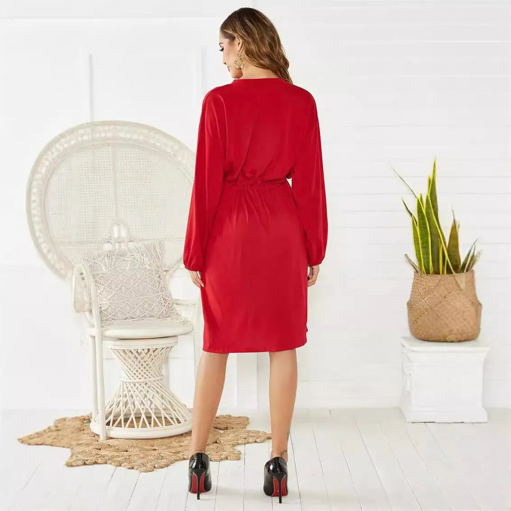 Women's black A-line midi dress with elastic waist, long sleeves, and cinched belt detail
