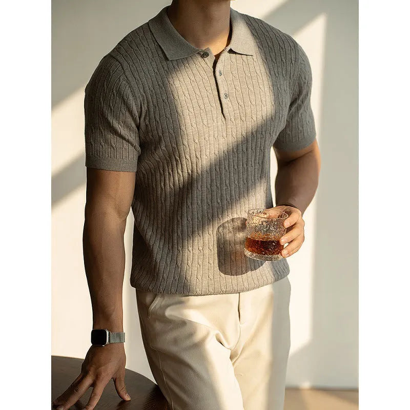 Men's khaki short-sleeve business top on a hanger.