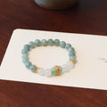 Women's bracelet with a Myanmar jade safety buckle pendant and lucky beads on a geometric crystal band.