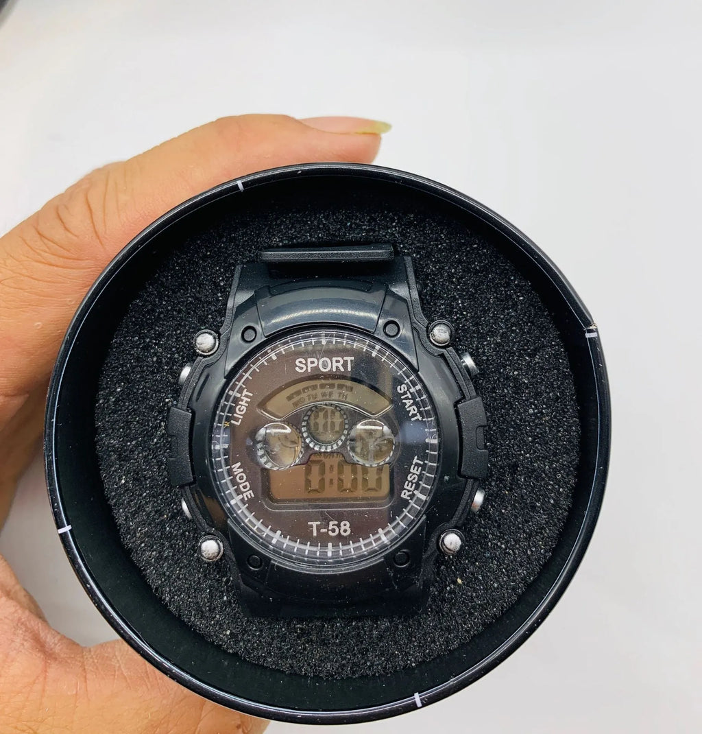 Children's digital sports watch with silicone strap showing time, alarm, and calendar on display.