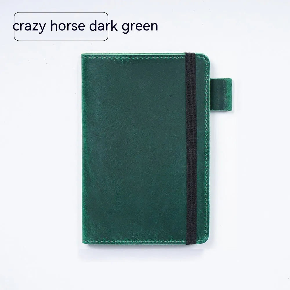 Handmade cowhide leather notebook open showing 100g wood-free paper with dark green cover
