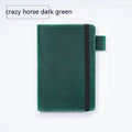 Handmade cowhide leather notebook open showing 100g wood-free paper with dark green cover