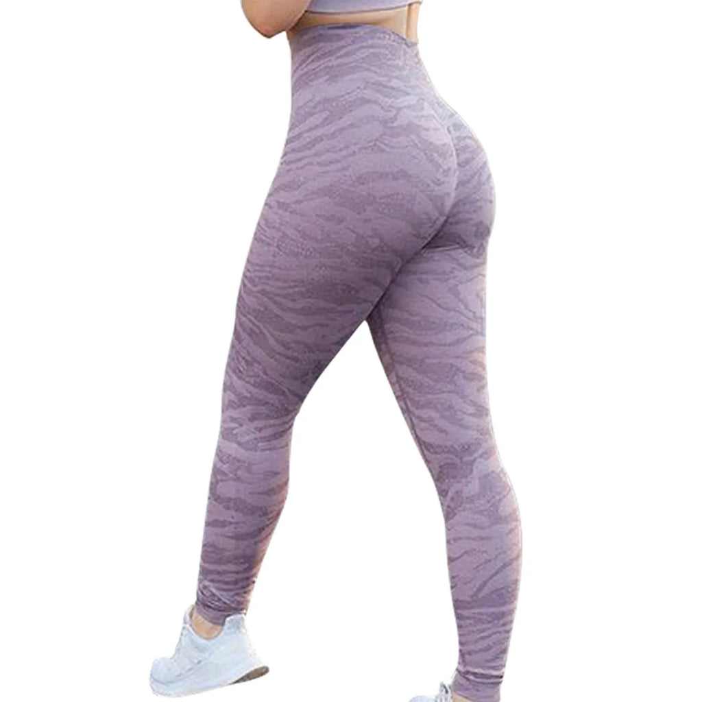 Women's butt-lifting fitness leggings in a camouflage print, shown on a model.