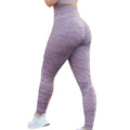 Women's butt-lifting fitness leggings in a camouflage print, shown on a model.