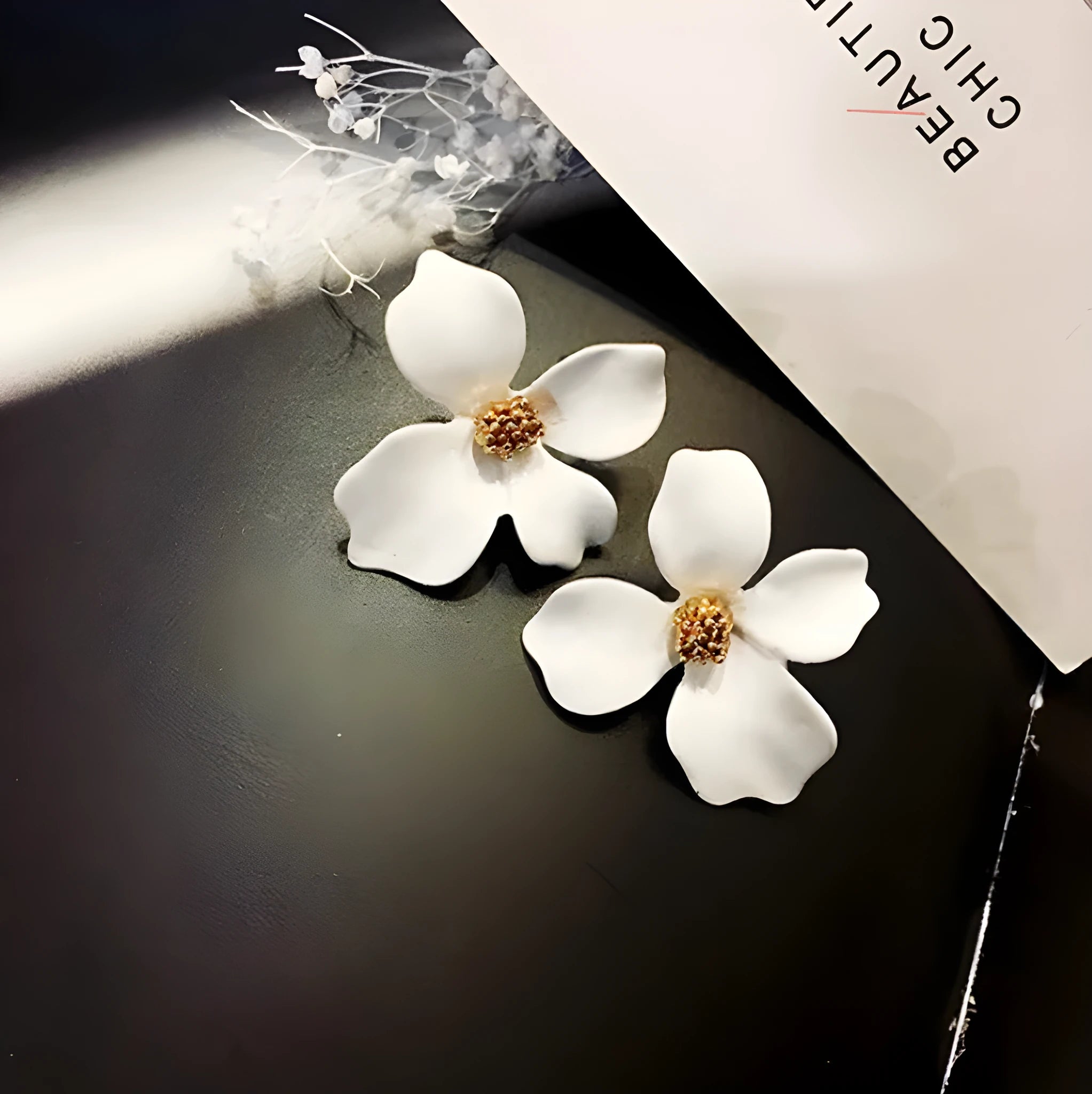 Flower shaped stud earrings for women in pink or white electroplated alloy