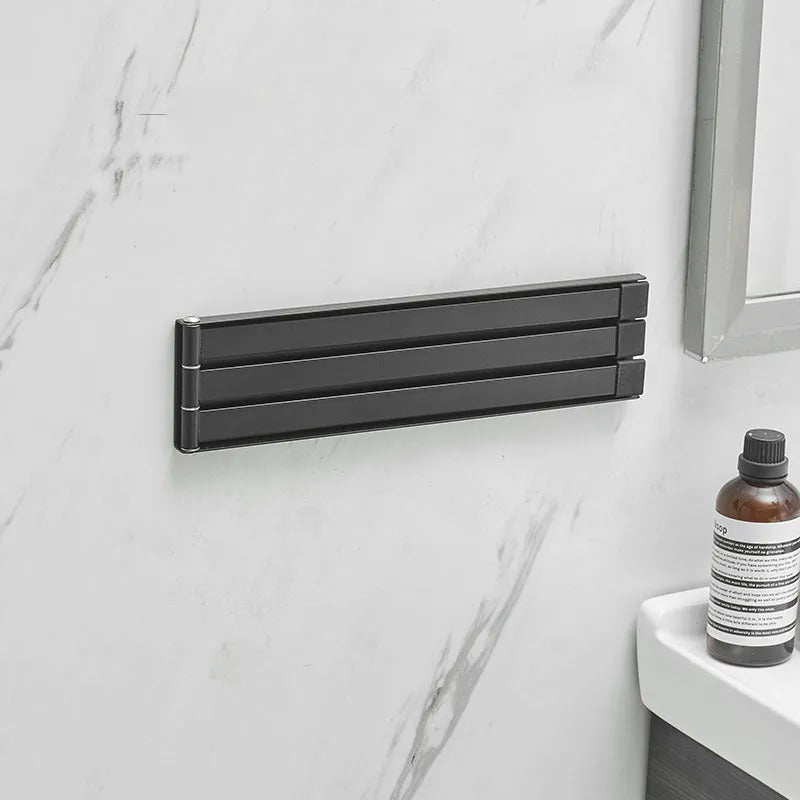 Nordic style non-perforated folding towel rack in black or white for bathroom installation without drilling
