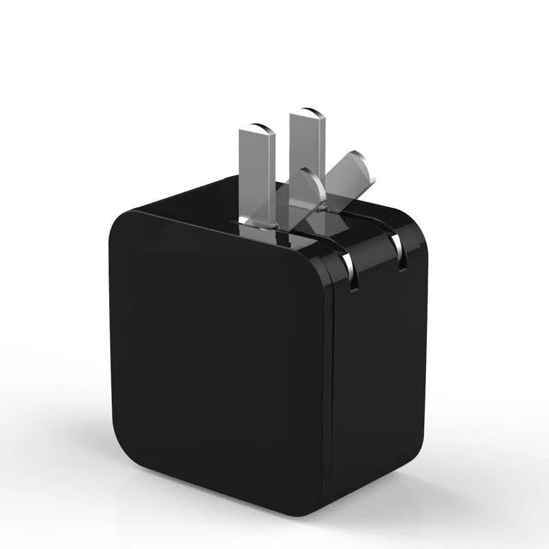 Black 5V2A dual USB travel charger with digital display showing charging status next to a smartphone.