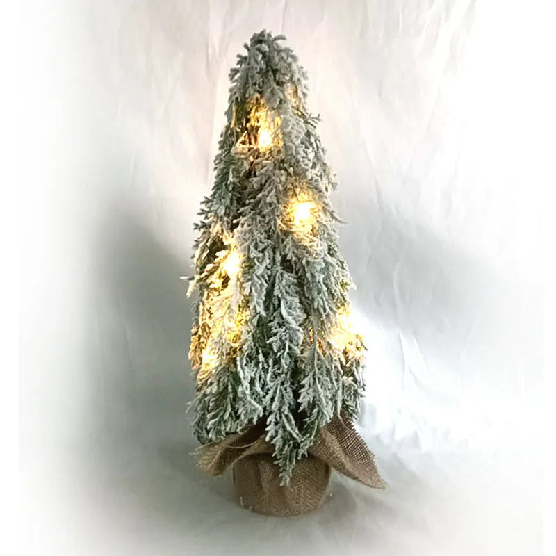 24-inch white snowy plastic desktop Christmas tree with built-in lights and one ornament.