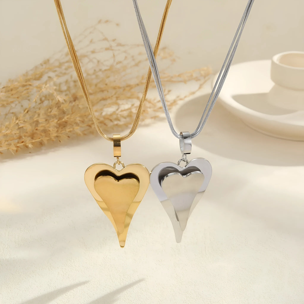 Women's stainless steel necklace with geometric pendant on double heart snake bones chain