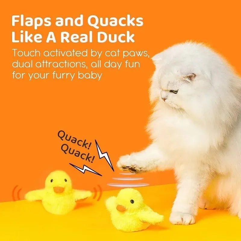 Yellow flapping duck cat plush toy with vibration sensor and USB charging cable on a neutral background.