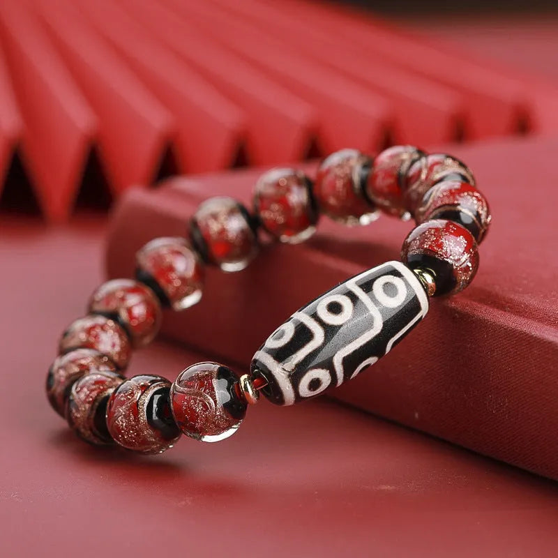Close-up of a colourful Chinese snake year lucky bead bracelet made from hand-strung coloured glaze.