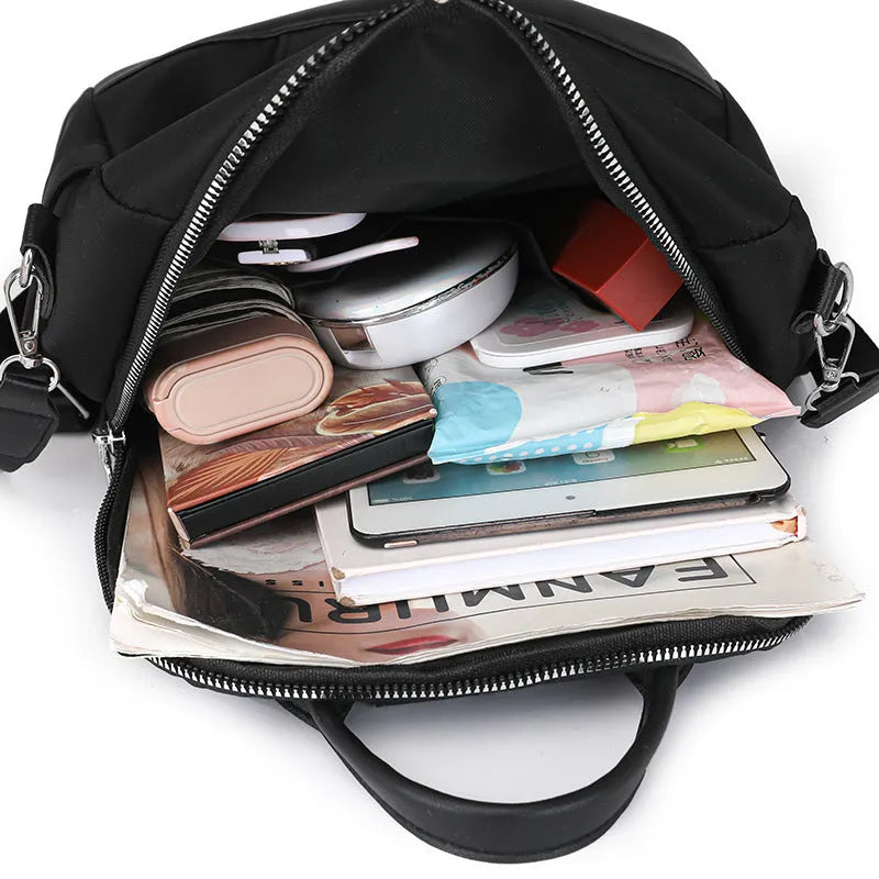 Large soft PU backpack in multiple colours showing three-dimensional pockets and internal phone compartment