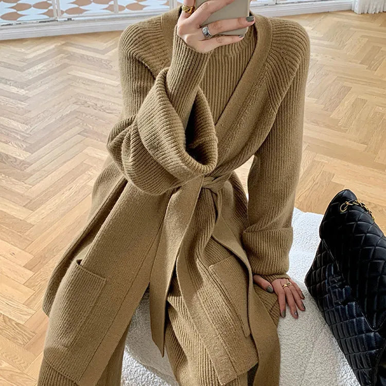 Women's knitted three-piece clothing set showing wide-leg pants, sweater and cardigan in solid colour with leather stitching details