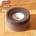 Green, blue, and brown pet suspension drinking bowl with separate base plate on a white background.