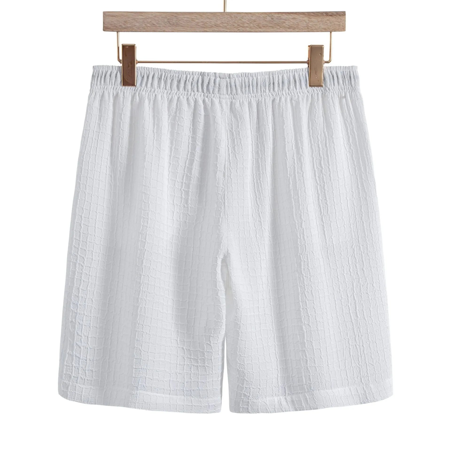 Man wearing a white cotton blend jacquard short sleeve shirt and matching shorts casual suit