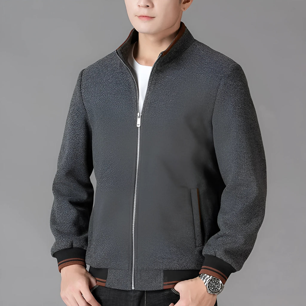 A grey men's sports-style fleece jacket with long sleeves, shown on a hanger.