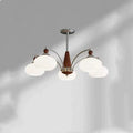 Chrome and persimmon glass chandelier ceiling light with multiple bulbs for dining room.