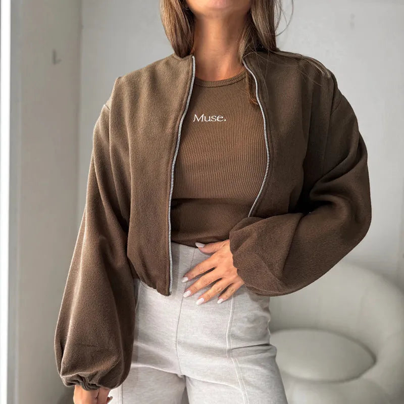 Women's off-shoulder coat with lantern sleeves in brown colour showing round neck design and pocket detail