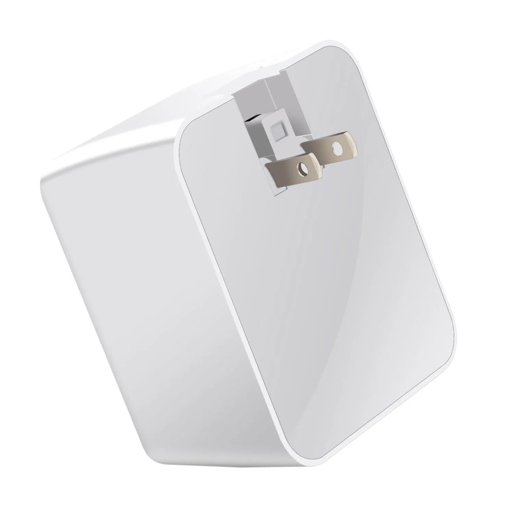White 4-port QC3.0 and Type-C fast travel charger with optional international plugs on a table.
