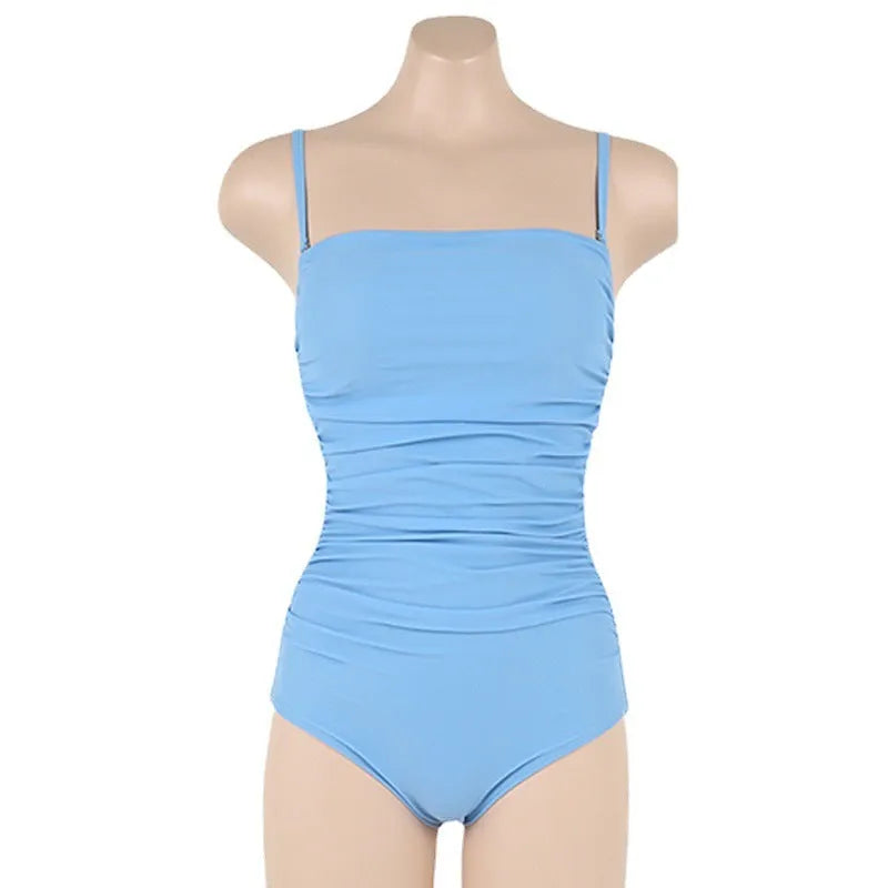 Sling style belly pleated one-piece swimsuit in solid colour on a mannequin.