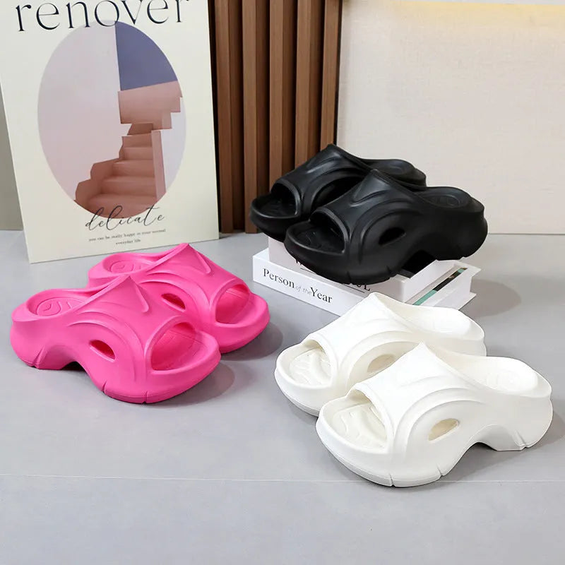 Women's thick-soled round-toe EVA slippers in rose red colour on a white background.