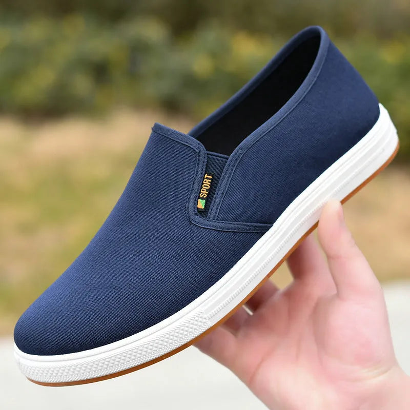 Men's black low-top canvas slip-on shoes with round toe and composite sole