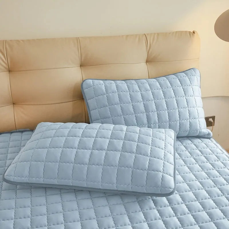 Class A waterproof washed cotton fitted bed sheet shown in light grey, fitted over a mattress.