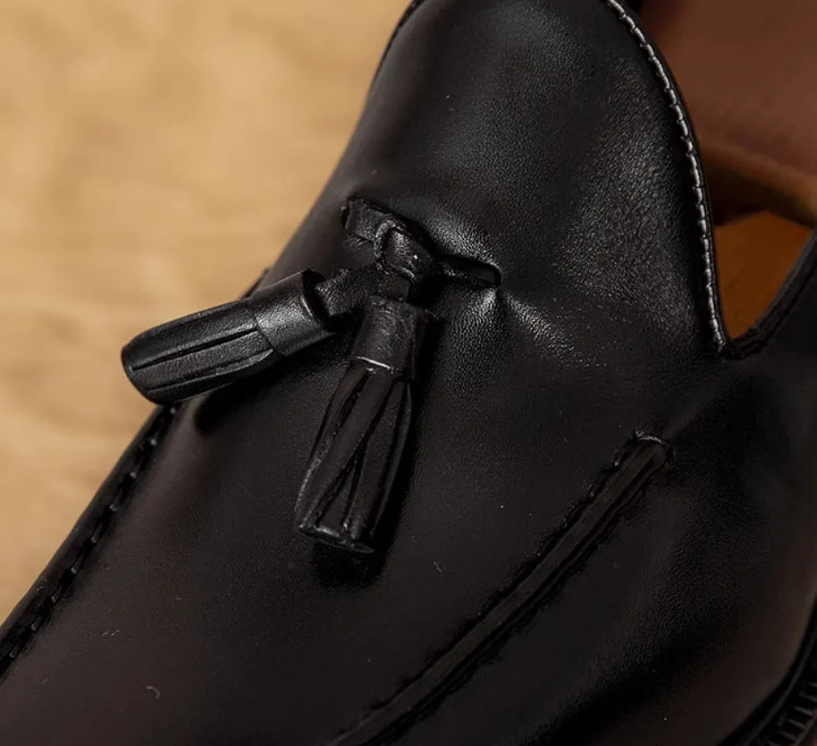 Men's black genuine leather slip-on loafers with fringed detailing and rubber sole