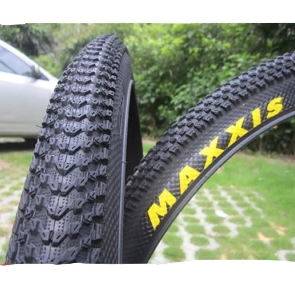 Ultralight mountain bike tyre with reinforced sidewall shown in black, suitable for 26, 27.5 or 29 inch wheels