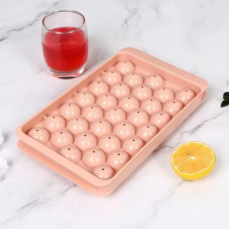 Blue PE ice cube tray with lid showing 33 round moulds.